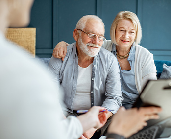 Elderly Couple speaking with Dr. Photo